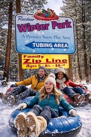 A sign for Ruidoso Winter Park indicating a premier snow play area and tubing area.