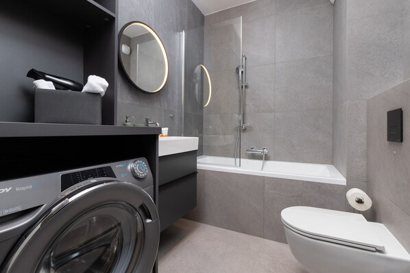 Shower, hair dryer, towels, shampoo