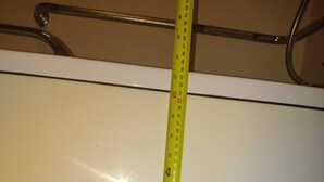 A measuring tape against a white wall. - Beacon Lodge, accessible, family and dog friendly. (NEWQUAY)