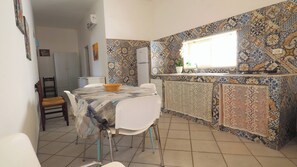 Fridge, stovetop, coffee/tea maker, cookware/dishes/utensils