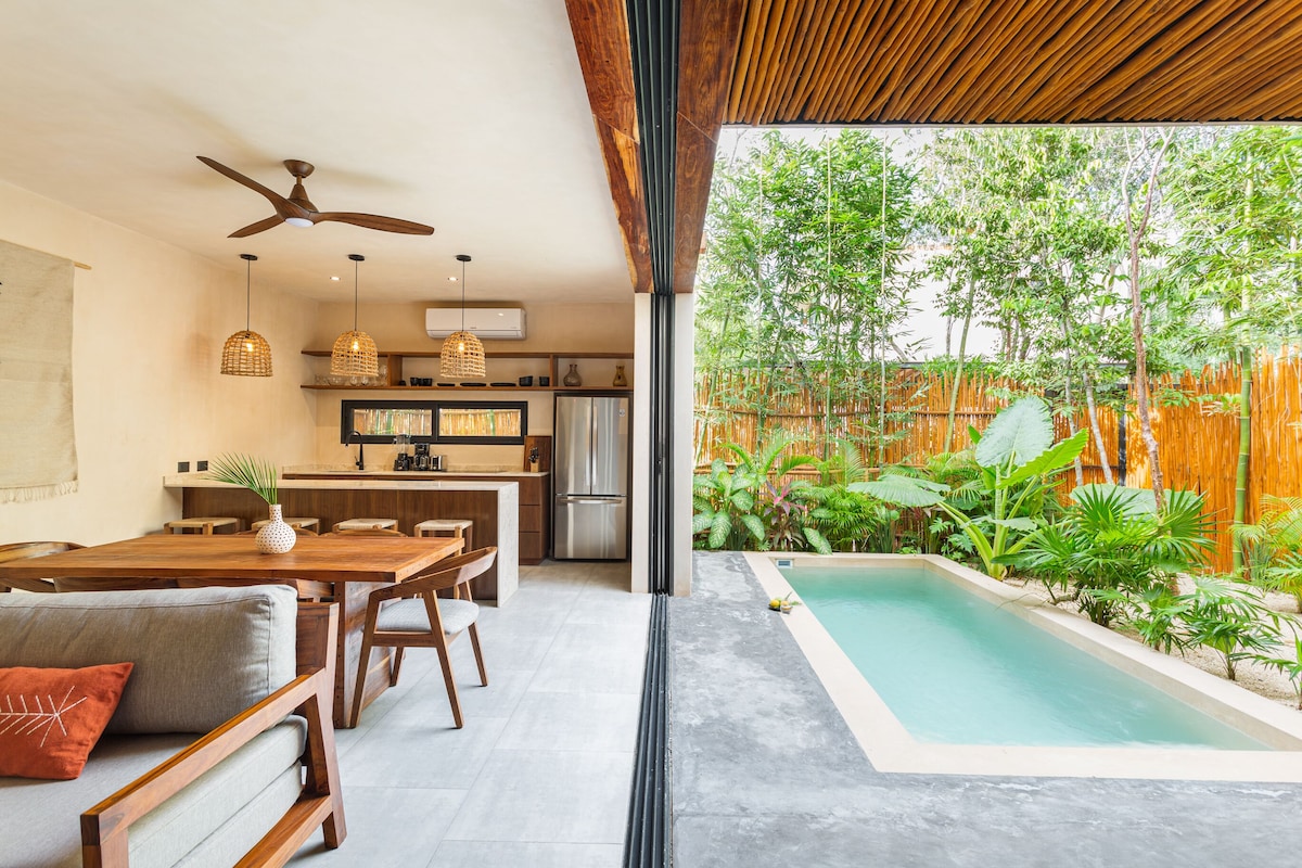 one of the family apartments in Atman Residences Tulum Hotel, with a spacious lounging area and dining area, a private pool outside