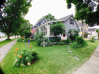 Snowmobiling, hiking, rafting paradise from this gorgeous Millinocket home