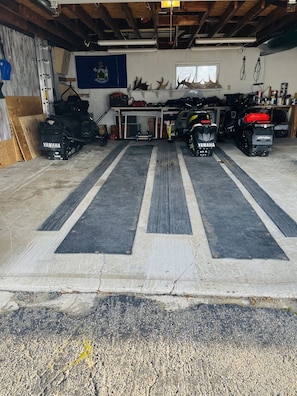 Work out in the garage with a workbench and ample space for tools and vehicles.