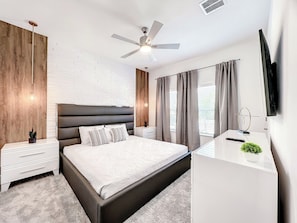 Modern Bedroom with Sleek Decor and Textured Accent Wall
