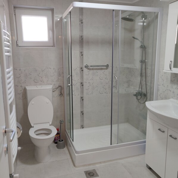 Shower, hair dryer, towels, soap