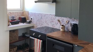 A compact kitchen with a window, a stove, a dishwasher, and a sink. - RIOPASSIONS, LARGE T3, BEAUTIFUL SEA VIEW (Toulon)