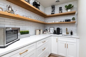 Enjoy cooking in this fully equipped kitchen with a coffee maker and toaster oven.