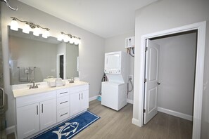 Combined shower/bathtub, towels, toilet paper