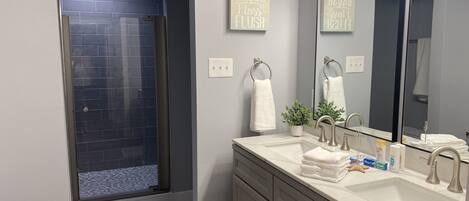 Bathtub, towels, soap, toilet paper