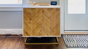 A modern bathroom with a wooden vanity, a mirror, a lamp, and a digital clock. - Walk to St Charles Main St. Shops, Eateries & Bars! (Saint Charles)