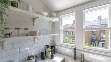 Coffee/tea maker, fridge, microwave, oven