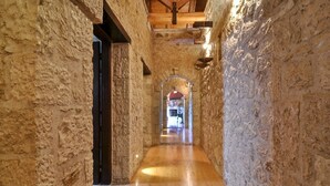 A narrow stone corridor with wooden flooring and a wooden ceiling. - Villa Fioretta - Four Bedroom Villa, Sleeps 8 (Ionian Islands)