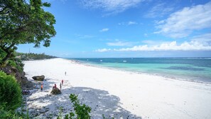 On the beach, sun loungers, beach towels