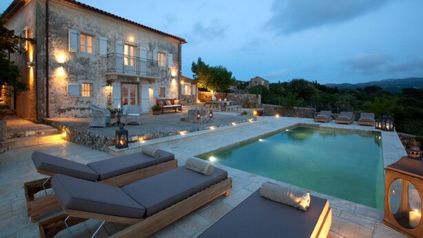 A stone building with a pool, outdoor seating, and a view of the countryside. - Villa Kothreas - Four Bedroom Villa, Sleeps 8 (Kothreas)
