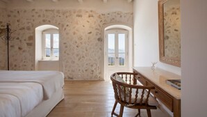 A bedroom with a bed, wooden desk, and two windows with views. - Villa Kothreas - Four Bedroom Villa, Sleeps 8 (Kothreas)