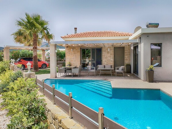 An infinity pool, sun loungers