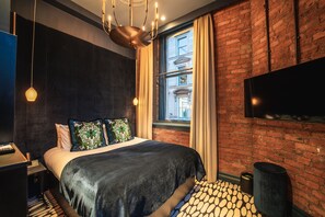 Luxe beddengoed, een minibar, een kluis op de kamer, een bureau