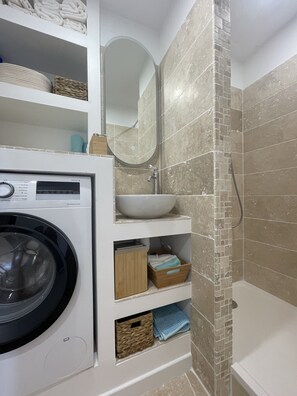 Shower, hair dryer, towels, soap