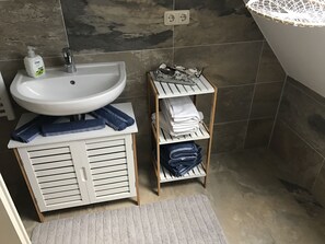 Shower, hair dryer, towels, soap