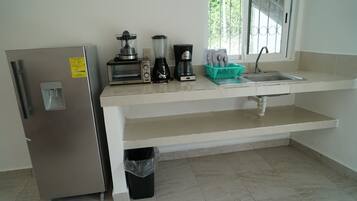 Family Villa, Multiple Beds, Kitchenette, Lagoon View | Private kitchenette | Mini-fridge, oven, dishwasher, cookware/dishes/utensils