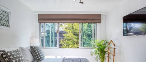 Deluxe Studio, 1 Bedroom, City View | 1 bedroom, down comforters, in-room safe, individually decorated