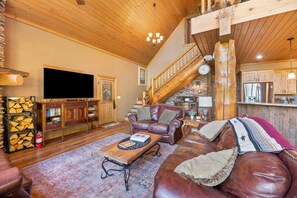 Téléviseur connecté, foyer, lecteur de DVD, table de baby-foot