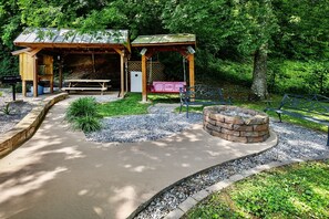 Relax in a shaded gazebo, enjoy a fire by the pit, and unwind with family near a picnic table and swing.