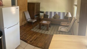 A compact living space with a kitchenette, a sofa, a dining table, and a chair. - Private 1br near downtown Flagstaff, NAU, Hospital (Flagstaff)