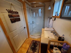Combined shower/tub, hair dryer, towels, soap