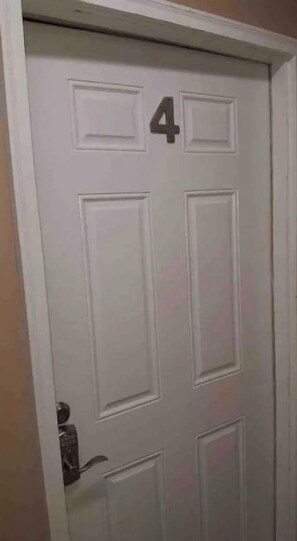 A white door with the number 4 on it.