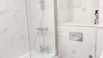 Combined shower/bathtub