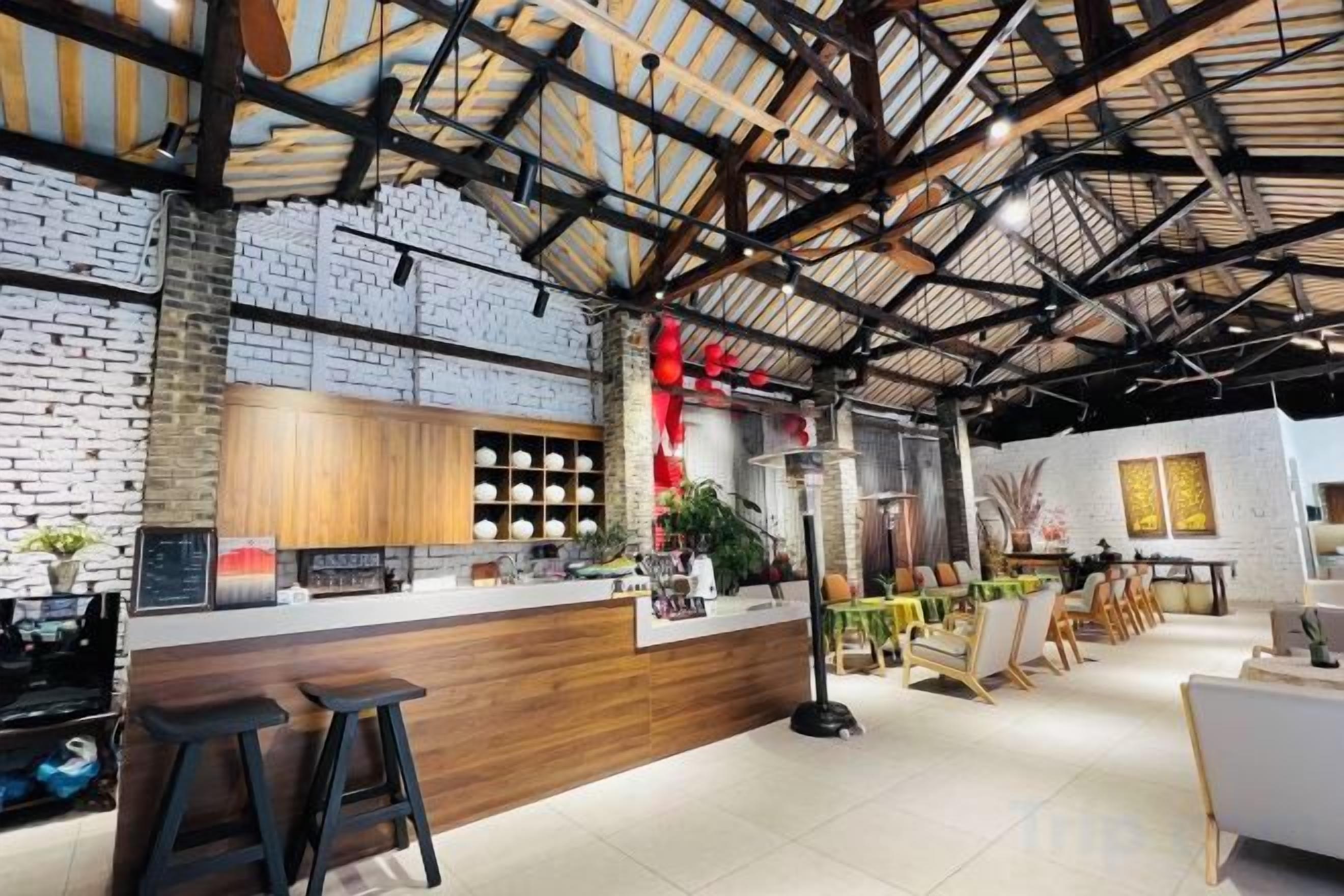 A modern interior with a bar area, wooden counter, and seating.