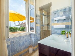 Bathtub, hair dryer, towels