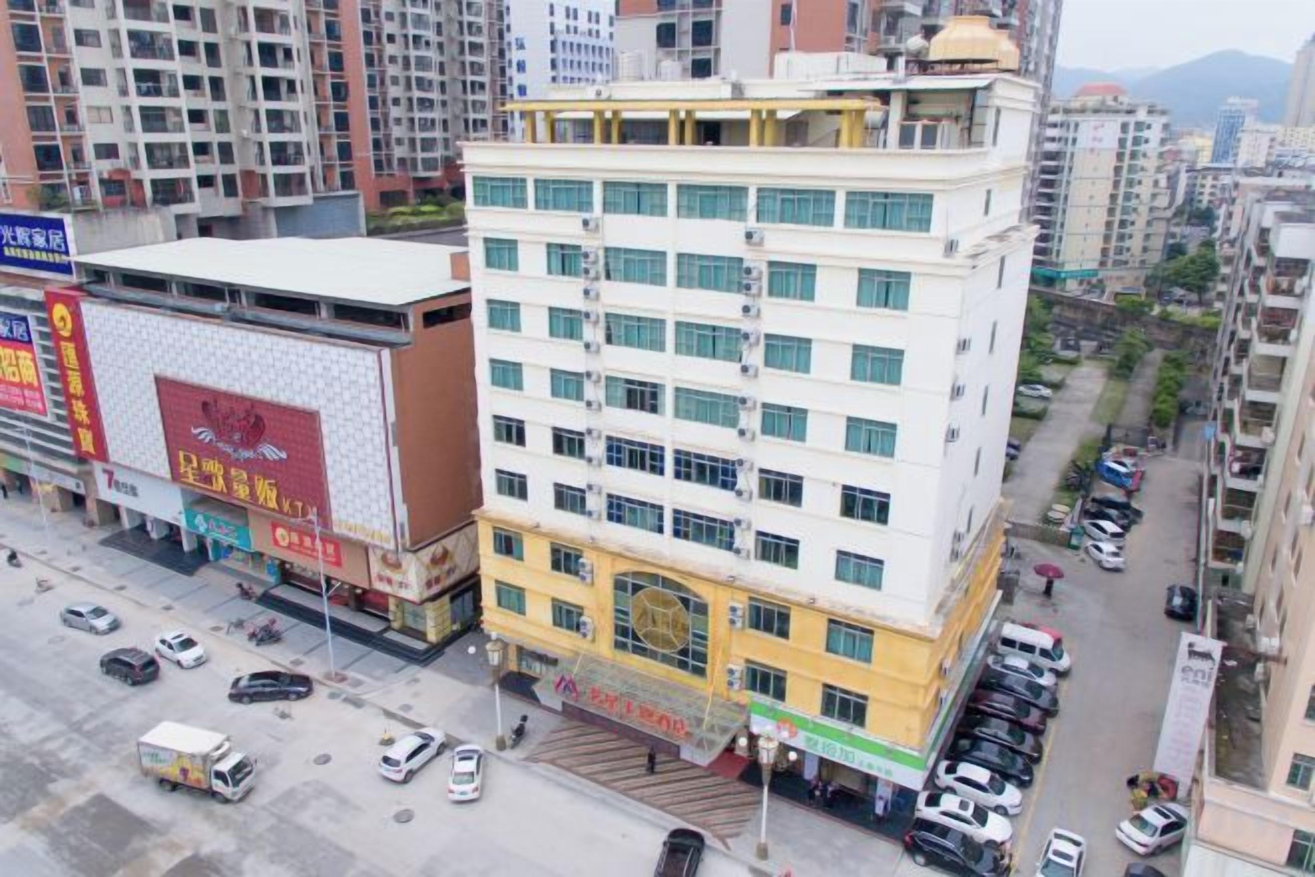 A multi-story building with a ground-level commercial space and upper residential or office units.