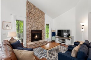 TV, fireplace, books, video library - Summer Morning - Resort access, 4 bd/3.5 ba, fire pit - Mr. Lake Lure Vacation Rentals (Lake Lure)