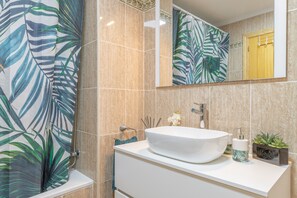 Bathtub, hair dryer, towels