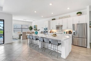 Fridge, microwave, oven, stovetop - Villa Rosa 1031 - BRAND NEW SE Cape Pool Home; Waterfront Property (Cape Coral)