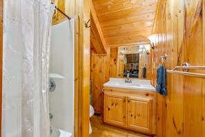 Combined shower/tub, hair dryer, towels, soap