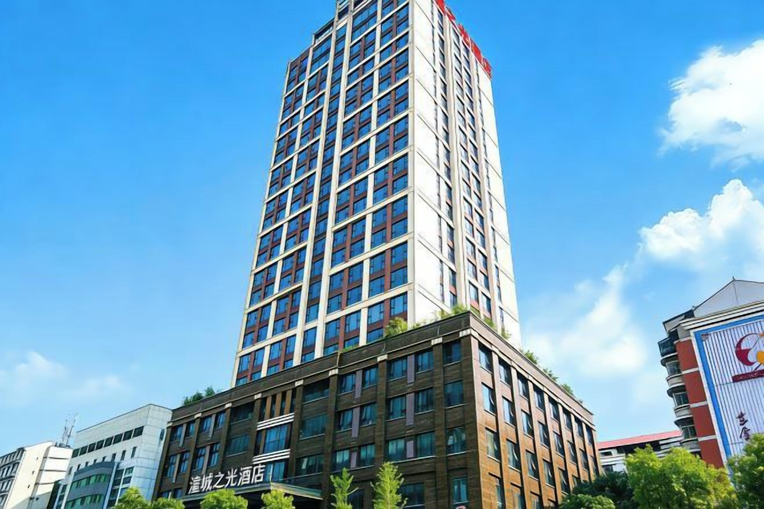 A tall, modern building with a clear sky in the background.