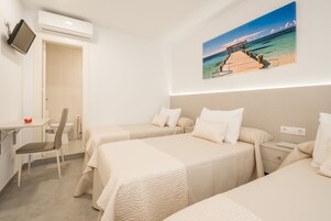 Desk, laptop workspace, free WiFi, bed sheets