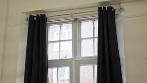 A window with black curtains and a white frame. - St. George hotel (London)