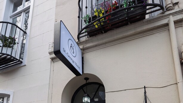 A building with a sign reading "St. George Hotel," a black door, and the number "46" on the wall. - St. George hotel (London)