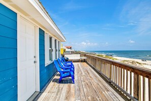 Relax on the deck overlooking the ocean with a scenic view.