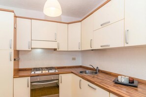 Family Apartment, Multiple Bedrooms (Piazzetta Casa Paola 200m From The) | Private kitchen - Piazzetta Casa Paola 200m From The Sea (Loiri Porto San Paolo)