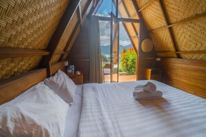 A room with a bed, a window, and a view of the outdoors. - Segara Camp Kintamani (Kintamani)
