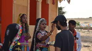 A traditional building with ornate architecture and a red exterior. - Barna Desert Camp (Jaisalmer)