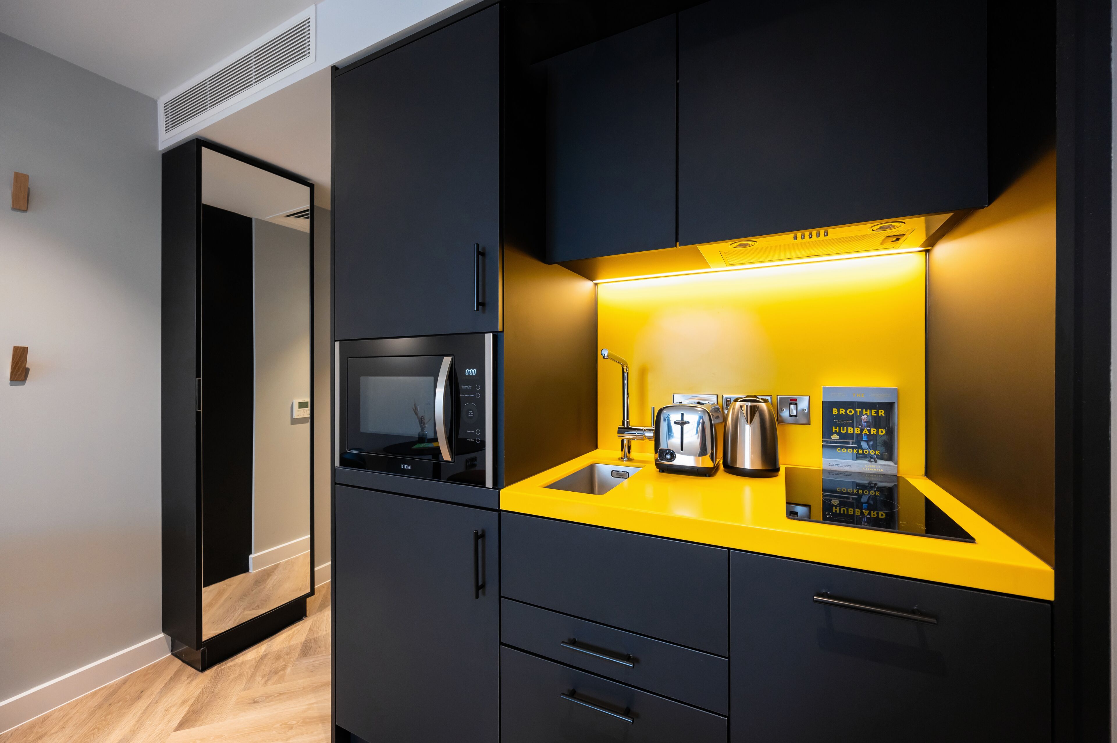 studio apartment | private kitchen | full-sized fridge, microwave, stovetop, dishwasher