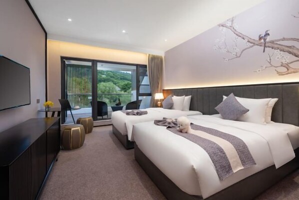 A modern hotel room with two beds, a flat-screen TV, a balcony with a view, and a painting of a tree. - Yinfeng Holiday Resort (Ningbo)