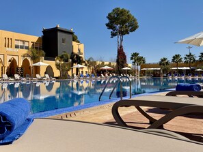 A pool area with lounge chairs, a reception sign, and a building labeled "MESA HOTEL". - El Olivar Palace Marrakech All Inclusive, Aquapark &amp; SPA (Marrakech)