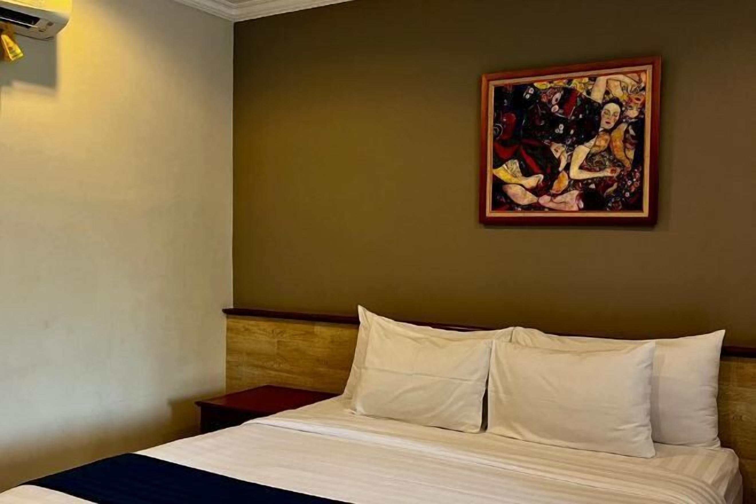 Premium bedding, memory-foam beds, laptop workspace, blackout curtains